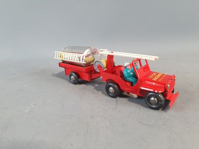 a red toy fire truck with a ladder on the back of it