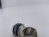 a silver ring with a blue and white design on it