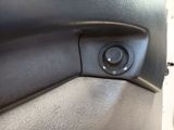 a close up of a button on a car door handle