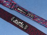 two ties with different designs on them on a blue surface