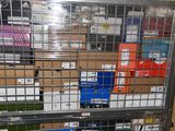 a metal cage filled with boxes and boxes of assorted items