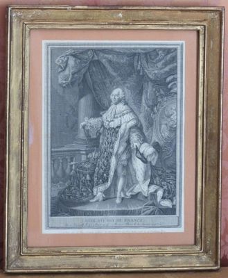 an old picture of a man and a woman with a dog in front of a wall