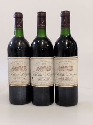 three bottles of red wine are lined up on a white surface