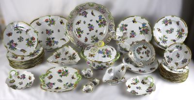 many plates and bowls that are sitting on a table