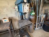 a machine that is sitting in a room with a lot of tools