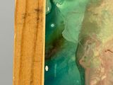 une photo d'un tableau représentant une femme en robe verte