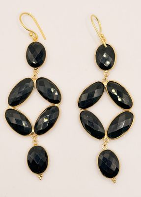 a pair of black stone earrings on a white background