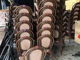 a lot of chairs that are stacked on top of each other