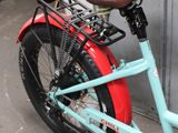 a bicycle that is parked in front of a garage door
