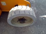 a tire that is sitting on the side of the road