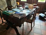 a desk with a lot of books on it