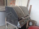 an image of a bbq with a large grill in it