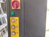an image of a machine that has a yellow button on it
