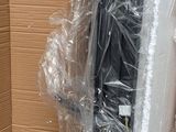 a cardboard box that has a bunch of luggage in it