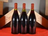 three bottles of wine sitting next to each other on a table