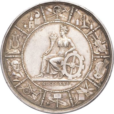an old silver coin with an image of a woman sitting on a wheel