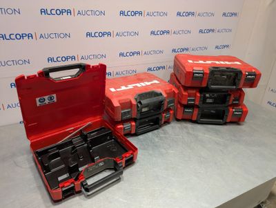 three red tool cases sitting on top of a table next to each other