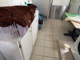 a washer and a dryer in a small room