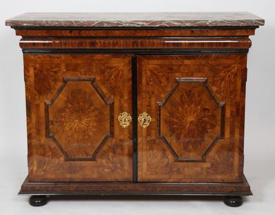 an antique wooden cabinet with marble top and two doors