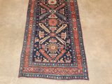 rug on the floor with a cat laying on top of it