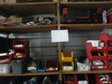 many different types of tools on the shelves in the garage