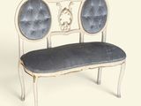 a white bench with a blue cushion on it