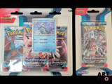 deux paquets de cartes Pokémon présentés dans leur emballage