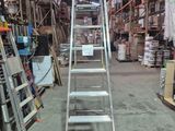 a ladder that is sitting in the middle of a warehouse