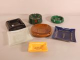many different types of cigarettes and ashtrays on the table