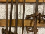 many old tools hanging on a wall in a room