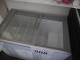 an open refrigerator with a freezer inside of it
