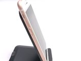 a cell phone that is sitting on top of a stand