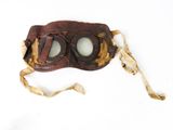 a brown leather mask with goggles attached to it