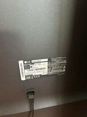 a close up of a laptop with a cable attached to it