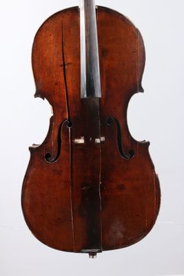 a close up of a violin on a stand against a white background
