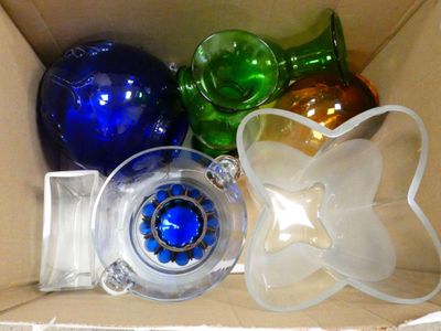 many different colored glass ornaments in a box