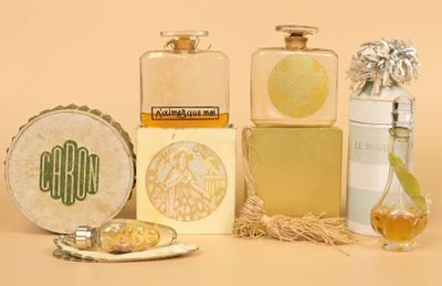 three bottles of perfume sitting next to each other on a table