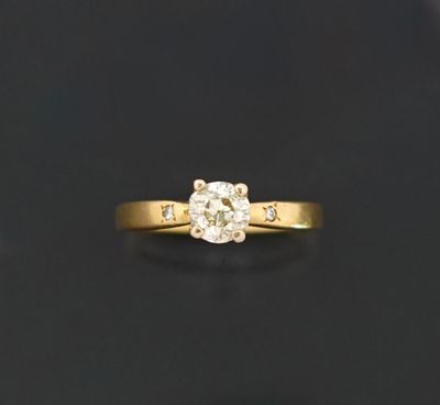 Solitaire en or jaune 18k 750 millièmes ornée d'un diamant d…