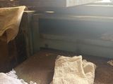a white towel sitting on the floor in the corner of a room