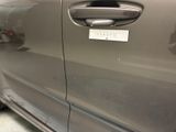 a close up of a car door handle with a sticker on it