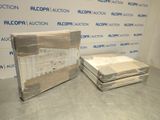 two boxes of mattresses sitting on top of each other in a room