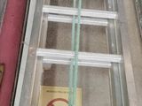 a ladder that is sitting on the floor next to a box