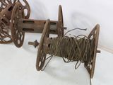 two spools and a spool of thread on the floor