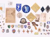 many different types of badges on a white surface