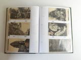 an open book with pictures of buildings on it