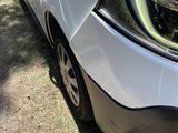 a close up of a car ' s front bumper and headlight