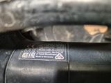 a close up of a motor bike with a sticker on it