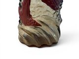 a red and white vase with a fish on it