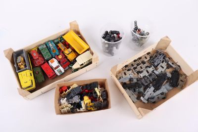 three boxes of legos sitting next to each other