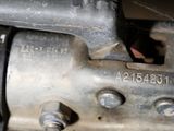 a close up of an old sewing machine with a needle